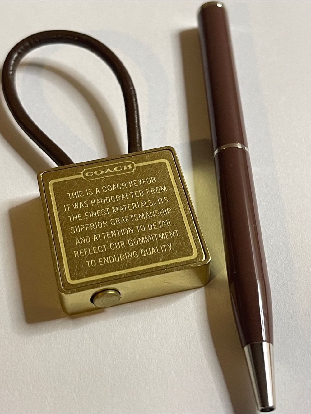 Coach Gold-Tone Brass Key Fob with Brown Leather Loop and Coach Pen